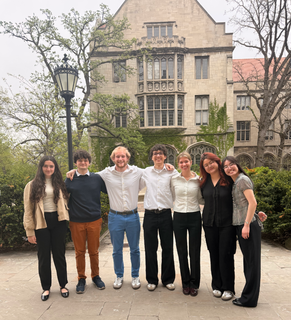 Cornell Ethics Bowl members standing together outside a campus building